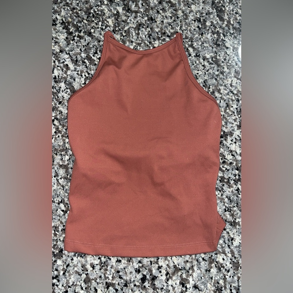 Five tank top never worn but no tags! Perfect condition bought new! 🤎